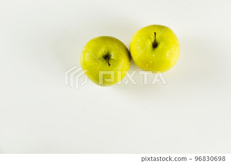top view of two green apples with drops on white background 96830698