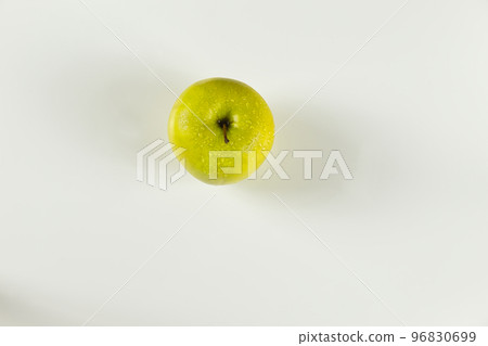 top view of green apple with drops on white background top view of green apple with drops on white background 96830699