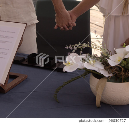 close-up of the hands of a couple entwined on their wedding day close-up of the hands of a couple entwined on their wedding day 96830727