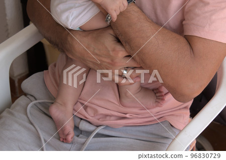 close-up of man holding his baby with love close-up of man holding his baby with love 96830729