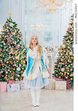 Snow Maiden in blue costume with kokoshnik sends an air kiss Snow Maiden in blue costume with kokoshnik sends an air kiss 96830887