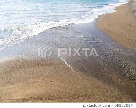 Mouth of a river flowing along a sandy beach. Mouth of a river flowing along a sandy beach. 96832034