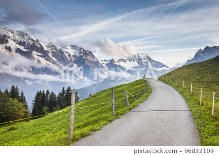 Snowcapped Bernese Swiss alps and mountain road in Murren, Switzerland 96832109