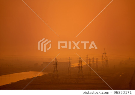 High voltage power lines and transmission towers at golden sunset. Industry energy supply concept High voltage power lines and transmission towers at golden sunset. Industry energy supply concept 96833171