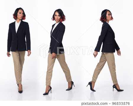 Half body 20s Asian Woman wear formal Business dress blazer high heel shoes. Black short curl hair female walk happy smile , walking forward left right over white background isolated 96833876