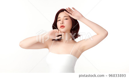 Beautiful Young Asian woman lifting hands up to show off clean and hygienic armpits or underarms on white background, Smooth armpit cleanliness and protection concept 96833893