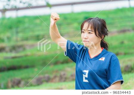 A Japanese woman who is a soccer fan and supporter who gets angry and boos while watching a soccer game A Japanese woman who is a soccer fan and supporter who gets angry and boos while watching a soccer game 96834443