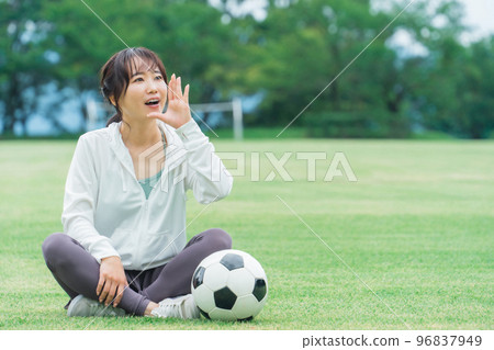 Asian woman cheering for soccer in sportswear 96837949