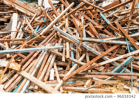 Pile of scrap iron with old steel frame in the construction site is rusting on steel. Steel boxes for building houses and high-rise buildings Pile of scrap iron with old steel frame in the construction site is rusting on steel. Steel boxes for building houses and high-rise buildings 96838342