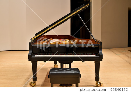 Image of a full concert grand piano 96840152