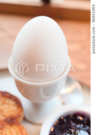 Boiled eggs on an egg stand 96841064