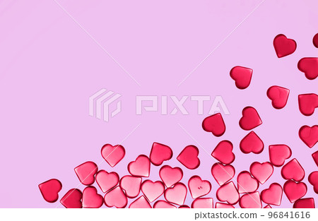 St Valentines day pink magenta background border. Many red transparent viva vibrant glass hearts flat lay. Love or wedding concept. Thank you 96841616