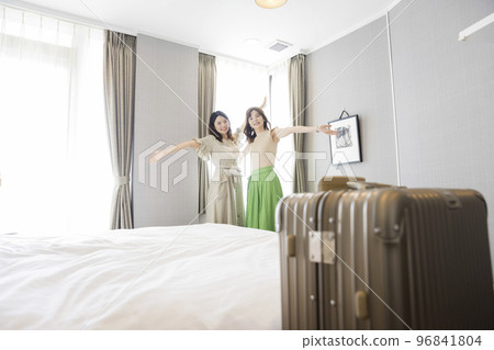 Parent and child mother and daughter posing at the hotel where they are staying National travel support 96841804