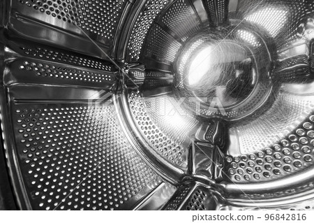 Close-up of inside of a steel washing machine drum Close-up of inside of a steel washing machine drum 96842816