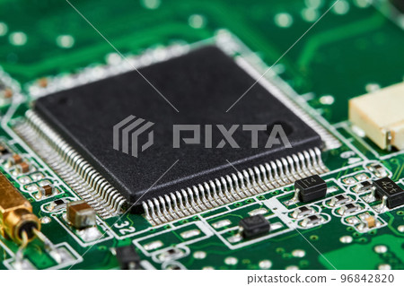 Close-up of computer chip on a part of electronic printed circuit board 96842820