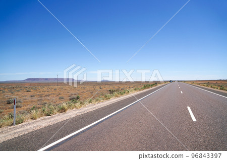 Endless roads in Central Australia 96843397