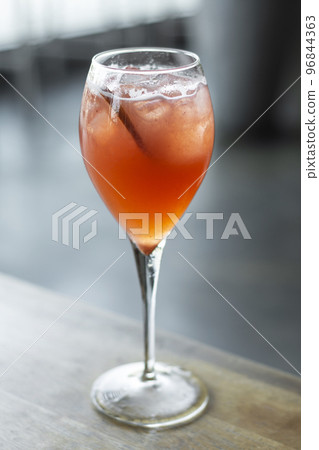 Blood Orange and Prosecco wine spritzer cocktail 96844363