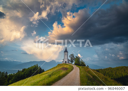 Stunning rural scenery with Saint Primoz church at sunset, Slovenia 96846007