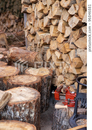 Stacked firewood for a wood stove and logs brought in 96846881