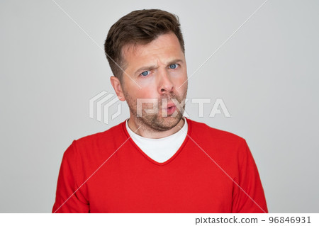 Crazy amazed young man open mouth unbelievable information. 96846931