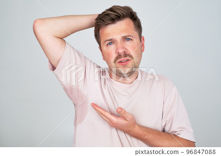 Man with hyperhidrosis sweating very badly under armpit Man with hyperhidrosis sweating very badly under armpit 96847088