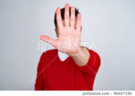 Mature man looking serious showing open palm making stop gesture 96847196
