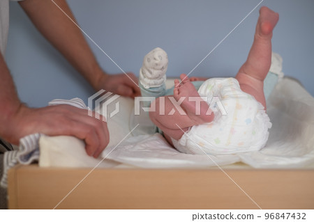 Newborn Baby legs on the changing table Newborn Baby legs on the changing table 96847432