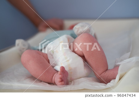 Newborn Baby legs on the changing table Newborn Baby legs on the changing table 96847434