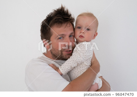 Father and daughter cuddling and bonding spending time together. 96847470