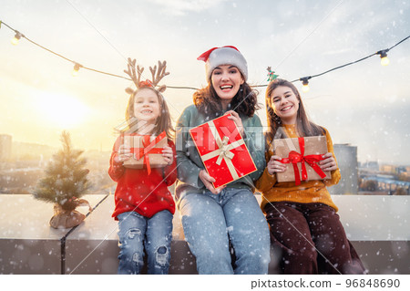 family preparing for Christmas 96848690