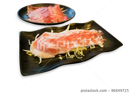 Top view of Sliced Beef with Shredded cabbage in the black plate, focus selective 96849725