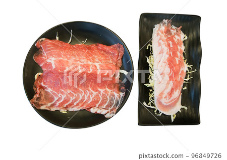 Top view of Sliced Beef with Shredded cabbage in the black plate, focus selective Top view of Sliced Beef with Shredded cabbage in the black plate, focus selective 96849726