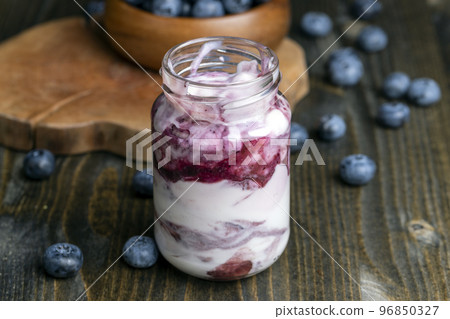 yogurt made from milk with blueberry flavor yogurt made from milk with blueberry flavor 96850327