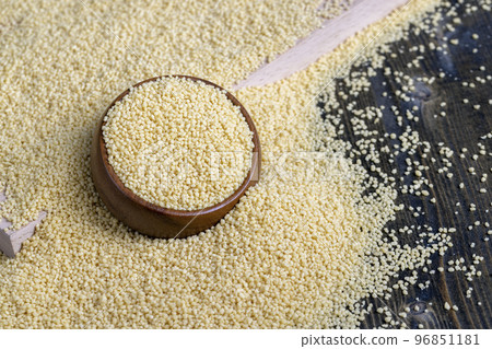 Fresh raw porridge couscous from wheat or millet 96851181