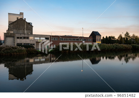 Wilsele, Flemish Brabant, Belgium,  Reflection of industrial buildings in the canal during sunset 96851482