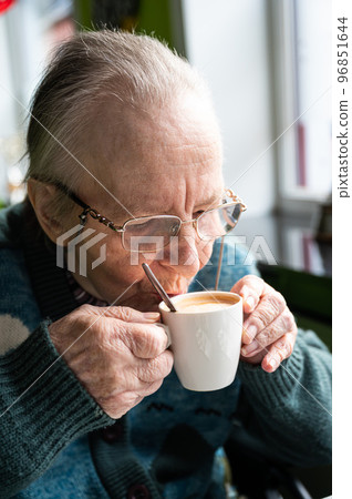 84 yo white woman drinking a cup of coffee, Tienen, Belgium 84 yo white woman drinking a cup of coffee, Tienen, Belgium 96851644