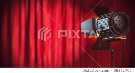 Stage or studio spotlight on red curtain background. Lighting equipment for Studio photography or videography. 96851763