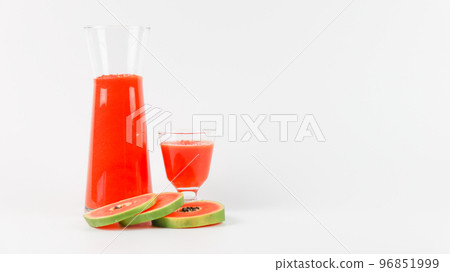 Papaya smoothie in glass jar and glasses on white background diet vegetarian healthy and freshness drink concept soft and selective focus 96851999