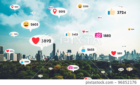 Social media icons fly over city downtown showing people reciprocity connection Social media icons fly over city downtown showing people reciprocity connection 96852176