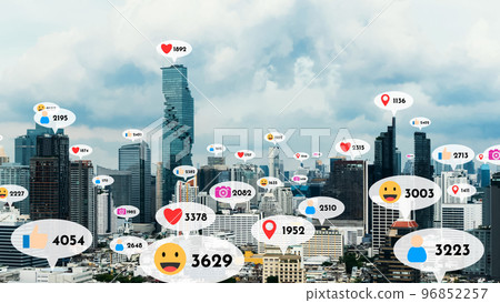 Social media icons fly over city downtown showing people reciprocity connection Social media icons fly over city downtown showing people reciprocity connection 96852257