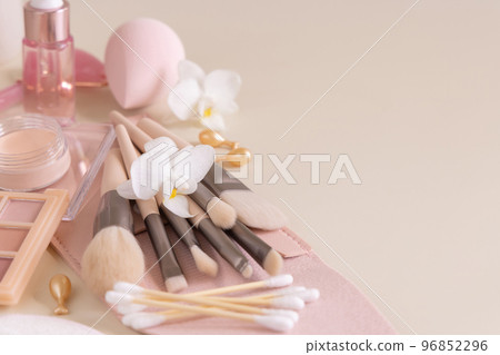 Skin care products and make up brushes on light beige close up, copy space Skin care products and make up brushes on light beige close up, copy space 96852296
