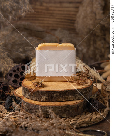 Handmade soap bar with blank label on wood near natural decorations close up. Mockup Handmade soap bar with blank label on wood near natural decorations close up. Mockup 96852387