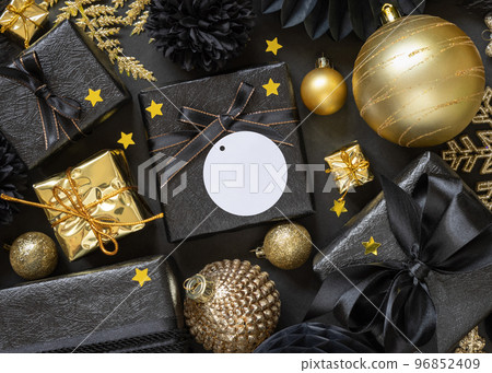 Black and golden Christmas Gift Boxes and ornaments, round gift tag Mockup Black and golden Christmas Gift Boxes and ornaments, round gift tag Mockup 96852409