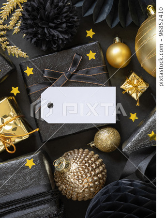 Black and golden Christmas Gift Boxes and ornaments, horizontal gift tag Mockup Black and golden Christmas Gift Boxes and ornaments, horizontal gift tag Mockup 96852410