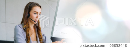 Business people wearing headset working in office in widen view 96852448