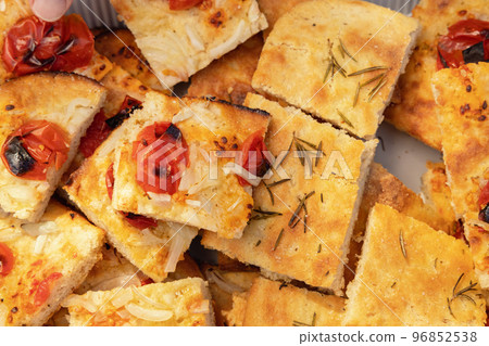 Freshly baked homemade apulian focaccia cut in slices top view. Barese focaccia bread 96852538