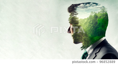 Concept of green business devotion shown by businessman and green forest trees Concept of green business devotion shown by businessman and green forest trees 96852889