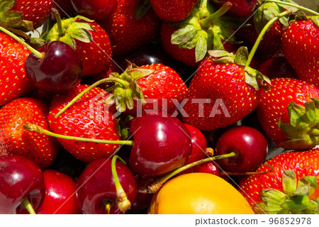 Ripe tasty berries apricot, sweet cherry, strawberry close up. Top view Ripe tasty berries apricot, sweet cherry, strawberry close up. Top view 96852978