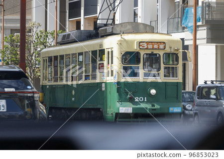 A tram running through Nagasaki City Tram seen from inside the car 96853023