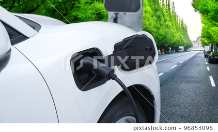 Progressive green city ESG style background with electric vehicle. Progressive green city ESG style background with electric vehicle. 96853098